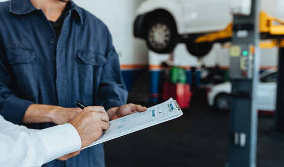 Car Mechanic with Customer