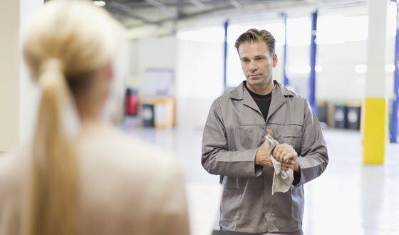 Car Mechanic & Owner Maintaining Social Distancing